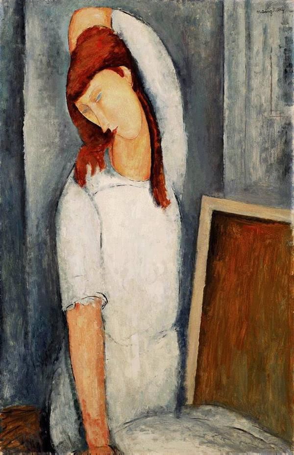 Amedeo Modigliani Oil Painting - portrait of jeanne hebuterne with her left arm behind her head 1919